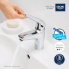 Grifo mezclador de lavabo GROHE Swift con función Eco y desagüe, cromado.
