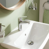 Grifo mezclador de lavabo GROHE Swift con función Eco y desagüe, cromado.